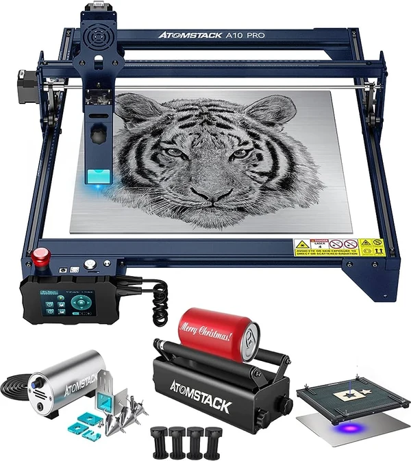 AtomStack A10 Pro diode engraver with a tiger photo engraving on the bed, shown with rotary attachment and honeycomb panel