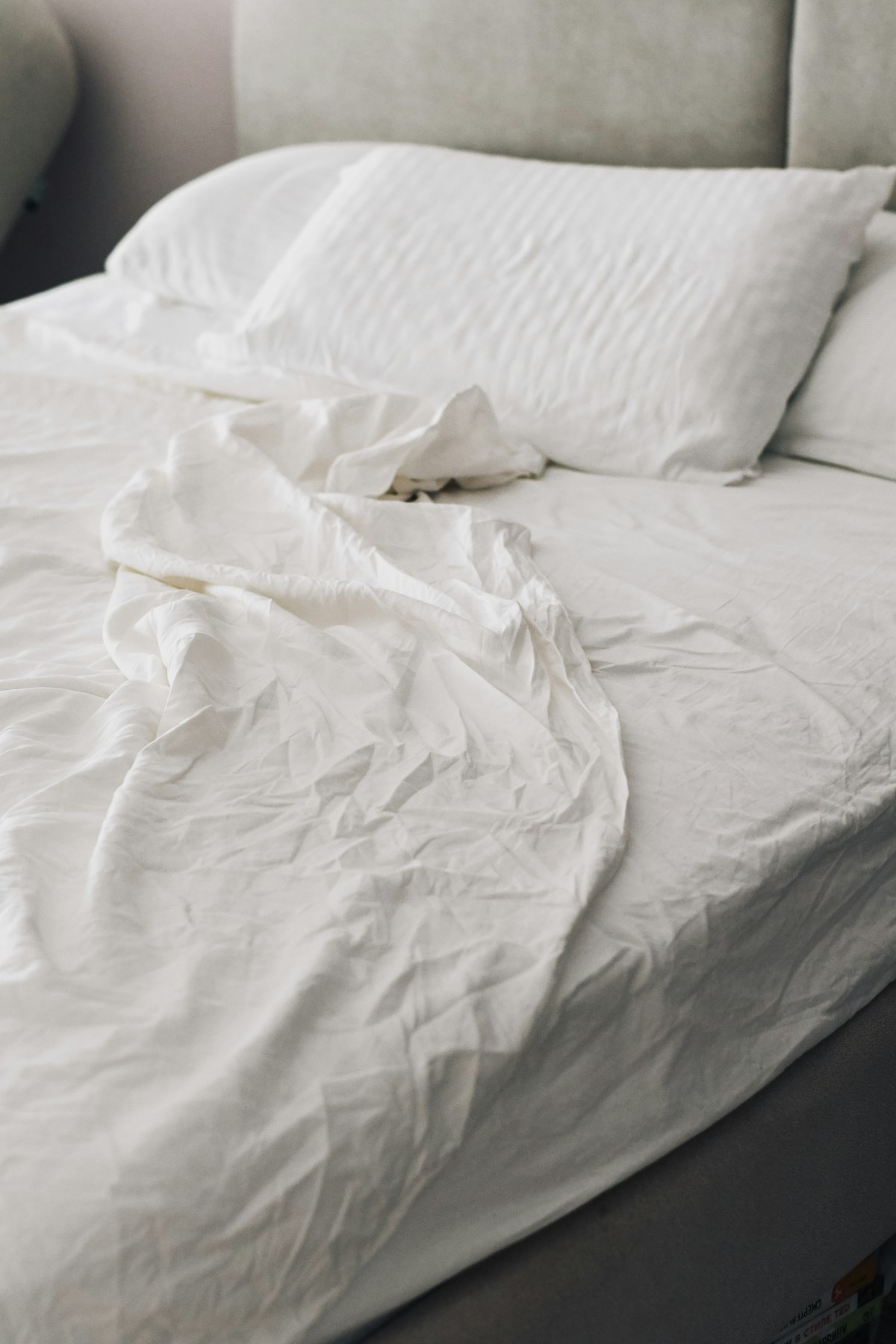 Rumpled pillows on a bed
