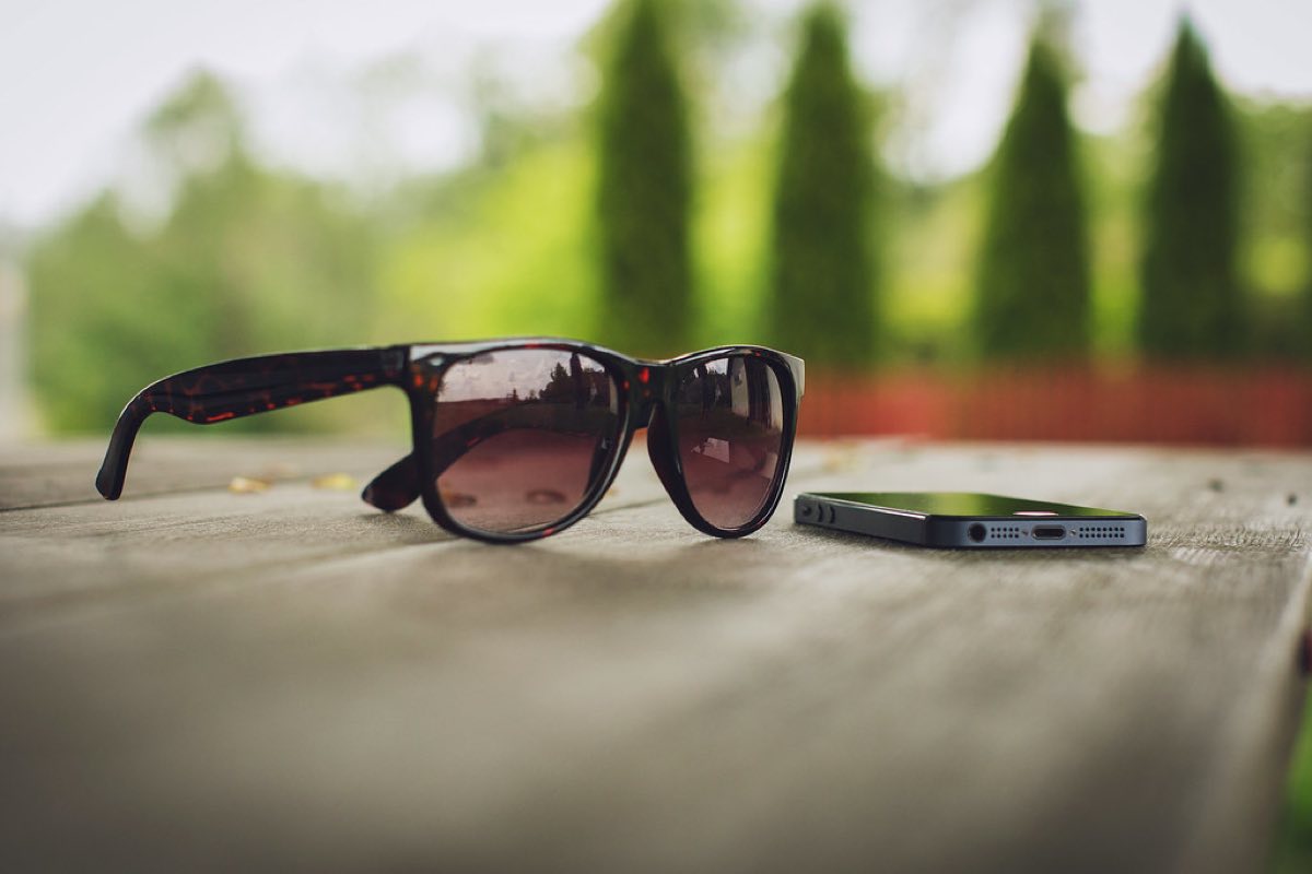 Designer sunglasses on wooden table
