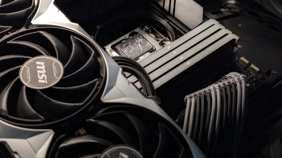 Close-up of a computer motherboard with a cooling fan
