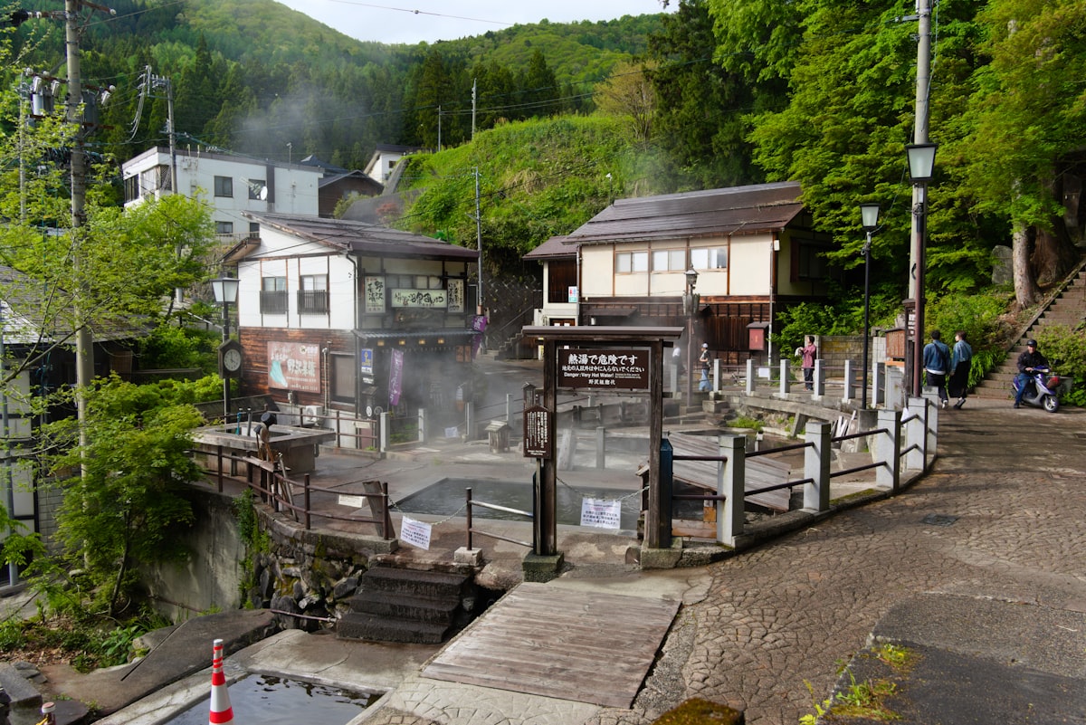 A traditional Japanese hot spring (onsen) with steam rising