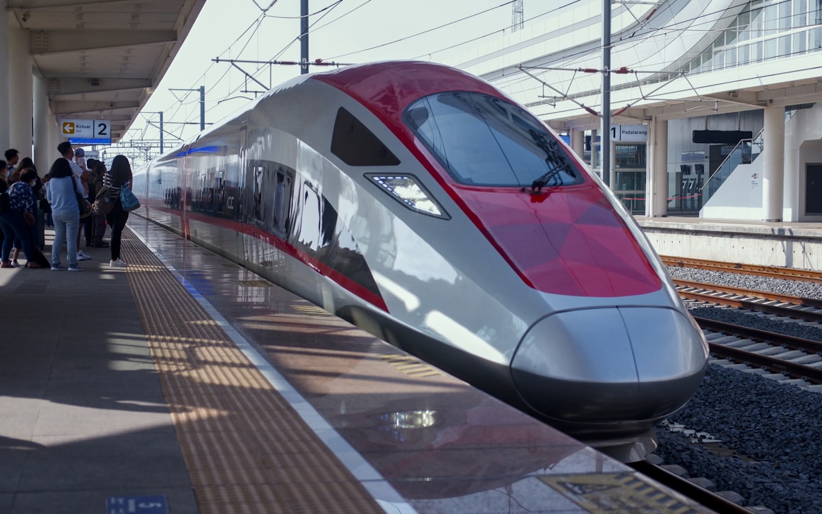 A high-speed train pulling into a station